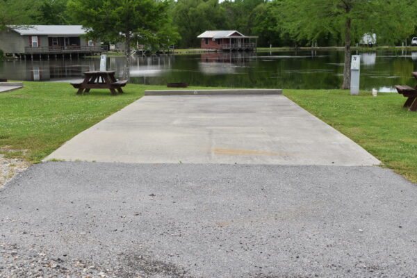 RV Site in front of Pond and Cabins
